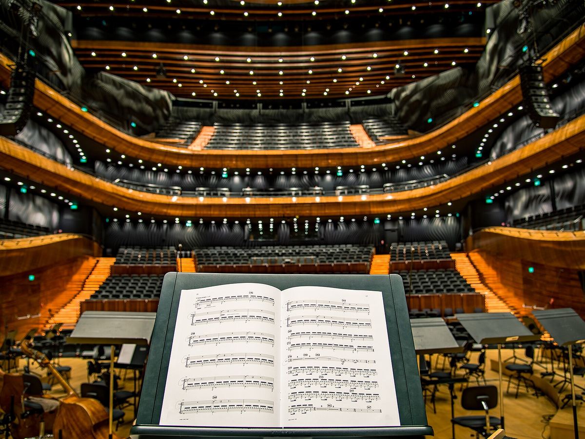 An empty concert hall seen from the conductor's podium